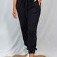 White Birch Full Size Drawstring Waist Rib-Knit Joggers with Pockets in Black