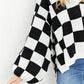 Davi & Dani Reality Check Full Size Checkered V-Neck Sweater